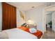 Bedroom featuring a desk, lamp, and a comfortable queen size bed at 6225 76Th N Ave, Pinellas Park, FL 33781