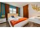 Comfortable bedroom with large windows, a desk, and a queen size bed at 6225 76Th N Ave, Pinellas Park, FL 33781