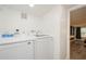 Bright laundry room featuring a modern, front-load Samsung washer and dryer at 6225 76Th N Ave, Pinellas Park, FL 33781