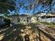 Home's backyard with sliding glass doors at 7326 Cutwater Ln, Wesley Chapel, FL 33545