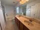 Bright bathroom with a double sink vanity, soaking tub, and separate shower at 7326 Cutwater Ln, Wesley Chapel, FL 33545