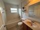 Bathroom with a tub/shower combo, vanity, and decorative shelves at 7326 Cutwater Ln, Wesley Chapel, FL 33545