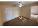 Bedroom featuring a ceiling fan, carpet, and closet at 7326 Cutwater Ln, Wesley Chapel, FL 33545
