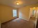 Bedroom featuring neutral carpet, a window for natural light, and a closet at 7326 Cutwater Ln, Wesley Chapel, FL 33545