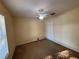 Bedroom with carpet, ceiling fan, and closet at 7326 Cutwater Ln, Wesley Chapel, FL 33545