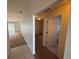 Hallway leading to carpeted living areas, bedrooms, and a bathroom at 7326 Cutwater Ln, Wesley Chapel, FL 33545