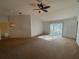 Open living area with sliding glass doors and carpet at 7326 Cutwater Ln, Wesley Chapel, FL 33545