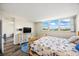 Well-lit bedroom with a large window offering scenic views and hardwood flooring at 7465 Bay Island S Dr # 316, South Pasadena, FL 33707