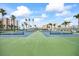 Exterior shot of the community tennis courts; enjoy friendly matches with blue and green color scheme at 7465 Bay Island S Dr # 316, South Pasadena, FL 33707