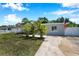This single-story home has a well-maintained lawn, and mature palms boosting curb appeal with a patriotic touch at 7631 18Th N Way, St Petersburg, FL 33702
