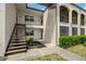 Multi-level building with balconies and stairs leading to the units at 7701 Starkey Rd # 445, Seminole, FL 33777