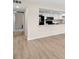 Open-concept kitchen featuring white cabinetry and modern appliances at 7701 Starkey Rd # 445, Seminole, FL 33777