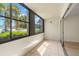 Enclosed lanai with tile floor and sliding glass door access to the living area at 7701 Starkey Rd # 445, Seminole, FL 33777