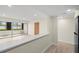 Bright living room with an enclosed lanai and a breakfast bar at 7701 Starkey Rd # 445, Seminole, FL 33777