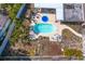 Overhead shot of an in-ground pool with seating, surrounded by a patio and a well maintained lawn at 843 37Th Ne Ave, St Petersburg, FL 33704