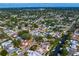 An elevated view reveals a community with canals, backyard pools, green trees, and attractive single-Gathering homes at 843 37Th Ne Ave, St Petersburg, FL 33704