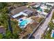 Birds eye view of a backyard with an in-ground pool, patio, seating area, and boat at 843 37Th Ne Ave, St Petersburg, FL 33704