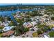 Aerial view of a residential area with waterfront houses, swimming pools, and lush landscaping near a canal at 843 37Th Ne Ave, St Petersburg, FL 33704