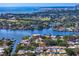 Expansive aerial shot of waterfront homes and canal leading to the ocean at 843 37Th Ne Ave, St Petersburg, FL 33704