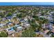 An aerial view of a neighborhood with a mix of homes, lush greenery and swimming pools at 843 37Th Ne Ave, St Petersburg, FL 33704
