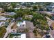 Waterfront property with backyard pool, boat, lush greenery, and serene views of the surrounding neighborhood and waterways at 843 37Th Ne Ave, St Petersburg, FL 33704