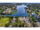 Picturesque aerial view of waterfront homes and a boat ramp along the canal with lush landscaping and serene waters at 843 37Th Ne Ave, St Petersburg, FL 33704