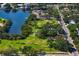 Aerial view of a green space next to the water and a tree lined street at 843 37Th Ne Ave, St Petersburg, FL 33704