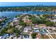 Aerial view of waterfront community with lush green landscaping, backyard pools and water access to bay at 843 37Th Ne Ave, St Petersburg, FL 33704