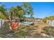 Relaxing backyard featuring a hammock, lush greenery, an inviting pool, and serene lounging areas perfect for outdoor living at 843 37Th Ne Ave, St Petersburg, FL 33704