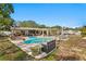 Home featuring an in-ground pool, patio with seating, and green space for outdoor enjoyment at 843 37Th Ne Ave, St Petersburg, FL 33704