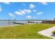 Beautiful backyard featuring a private boat dock with direct access to the bay at 844 Bay Point Dr, Madeira Beach, FL 33708