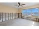 Bedroom with waterfront views through a large window, awaiting personalization at 844 Bay Point Dr, Madeira Beach, FL 33708