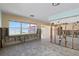 Large living area with waterfront views through windows, ready to be customized at 844 Bay Point Dr, Madeira Beach, FL 33708
