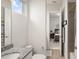 Open bathroom with a view through to the main bedroom at 8946 Ivy Stark Blvd, Wesley Chapel, FL 33545