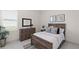 Cozy bedroom with a classic bed frame, dresser, and warm, natural lighting at 8946 Ivy Stark Blvd, Wesley Chapel, FL 33545