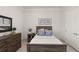 Comfortable bedroom with matching dresser and bedside table at 8946 Ivy Stark Blvd, Wesley Chapel, FL 33545