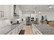 A modern kitchen features granite countertops, stainless steel appliances, and ample cabinet space at 8946 Ivy Stark Blvd, Wesley Chapel, FL 33545
