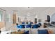 A beautifully designed living area shows an open floor plan, connecting the dining room and kitchen at 8946 Ivy Stark Blvd, Wesley Chapel, FL 33545
