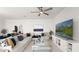 Spacious living room featuring a comfortable sectional sofa and a large flat-screen TV at 8946 Ivy Stark Blvd, Wesley Chapel, FL 33545