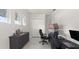 Bright office with tile floors, dual monitors and a comfortable chair for a productive work environment at 8946 Ivy Stark Blvd, Wesley Chapel, FL 33545
