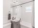 Bathroom with white subway tile, gray vanity, and a shower/tub combination at 930 23Rd N Ave, St Petersburg, FL 33704