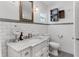 Renovated bathroom featuring a white vanity, subway tile, and modern fixtures at 930 23Rd N Ave, St Petersburg, FL 33704