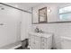 Bright bathroom featuring subway tile, a marble vanity, and a walk-in shower with updated fixtures at 930 23Rd N Ave, St Petersburg, FL 33704