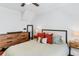 Bedroom featuring hardwood floors, a bed, and dresser offering ample storage space at 930 23Rd N Ave, St Petersburg, FL 33704