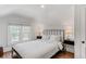 Bright bedroom featuring a large window and a comfortable bed with white linens at 930 23Rd N Ave, St Petersburg, FL 33704