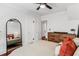 Bedroom with hardwood flooring, a bed, a full-length mirror and access to other rooms at 930 23Rd N Ave, St Petersburg, FL 33704