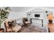 Finished attic bonus room with armchairs, desk, hardwood floors, and bright lighting at 930 23Rd N Ave, St Petersburg, FL 33704