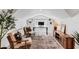 Attic bonus room featuring armchairs, a modern desk, and bright overhead lighting at 930 23Rd N Ave, St Petersburg, FL 33704