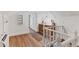 Bonus room featuring wood-look flooring, white walls, and a wet bar with bright lighting at 930 23Rd N Ave, St Petersburg, FL 33704