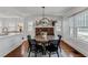 Chic dining area featuring a large round table, stylish chairs, and decorative fireplace at 930 23Rd N Ave, St Petersburg, FL 33704